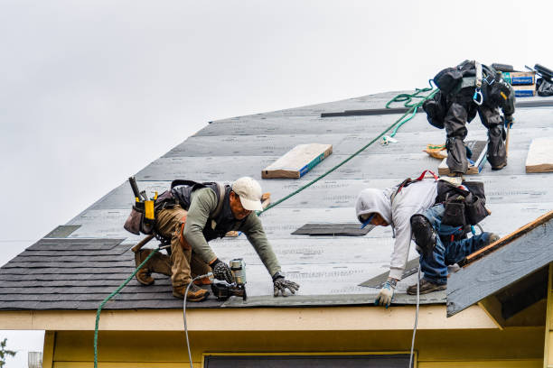 Professional Roofing technician working in Manorville, NY